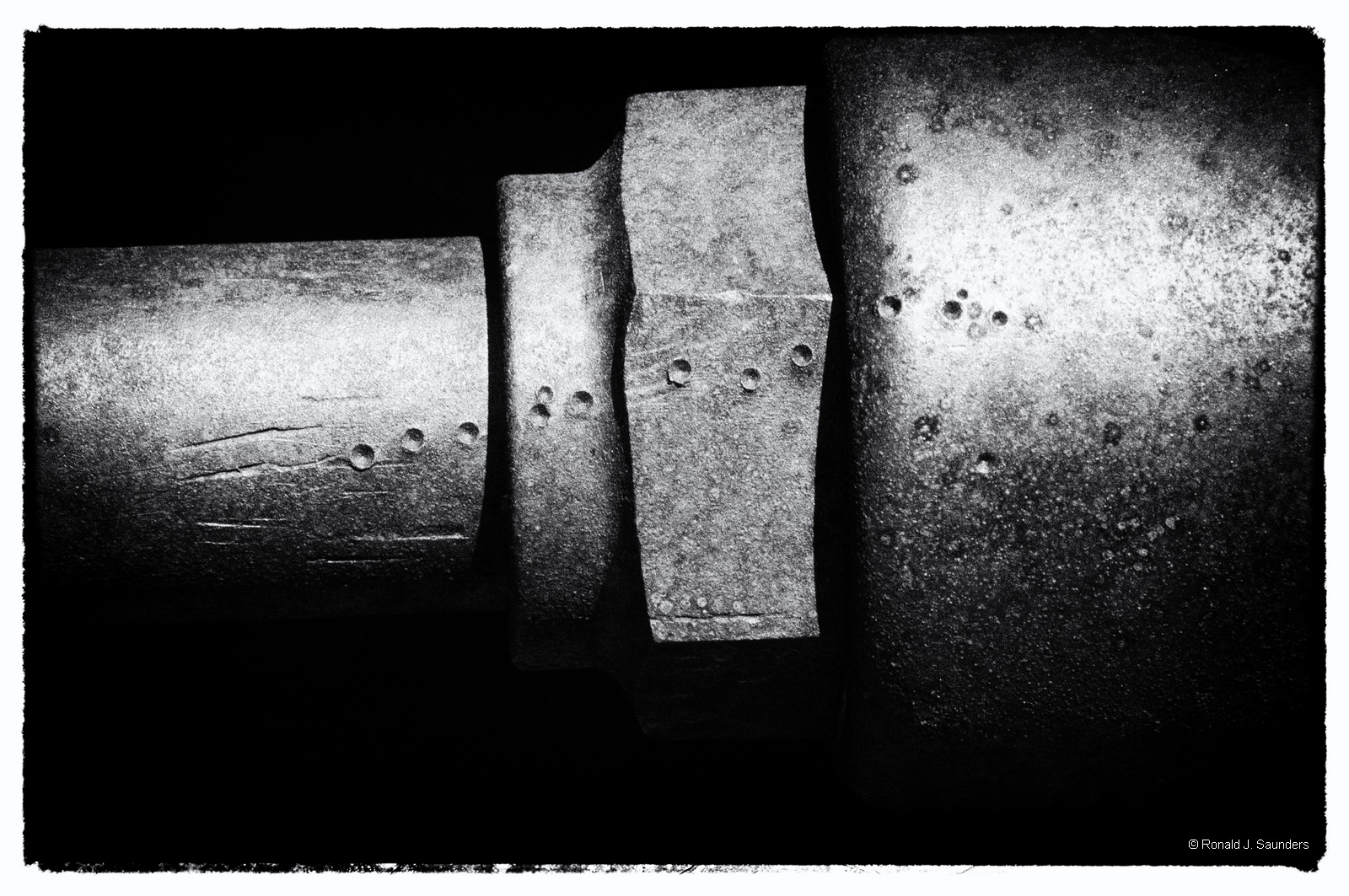 Punch marks in the steel are still clear and distinct on the surface of the steel parts. The marks may have been added by a mechanic...