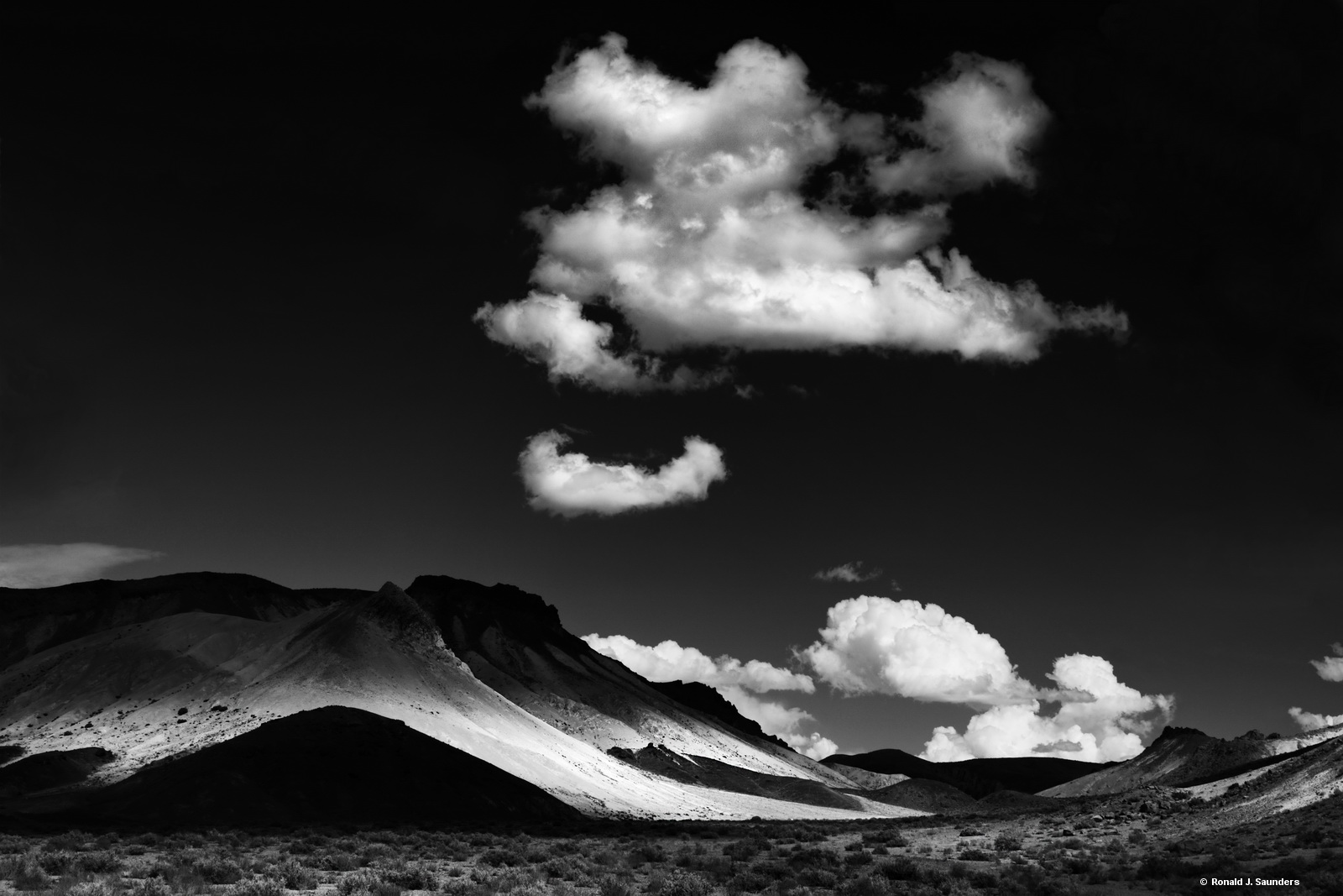 Clouds lit by the sun hover over Spring Gap.  This print has a companion print called Clouds over Spring Gap 2.  Both images...