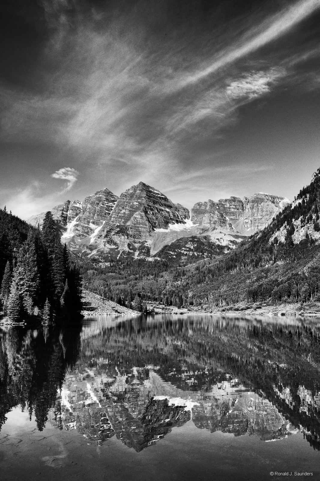 Uncounted photographers have positioned themselves before the lake to capture stunning images. This is my entry and interpretation...